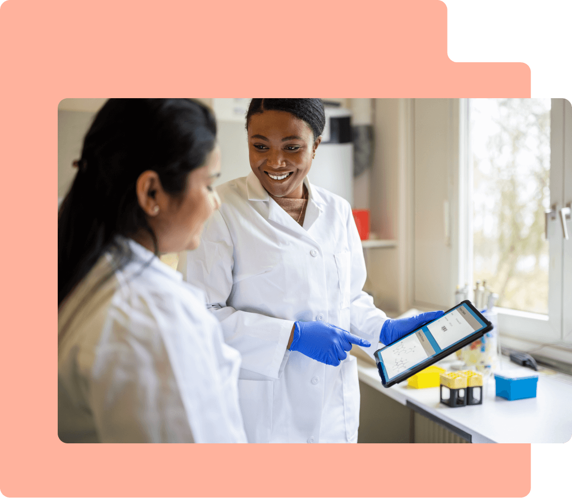 Female scientist looking over tablet