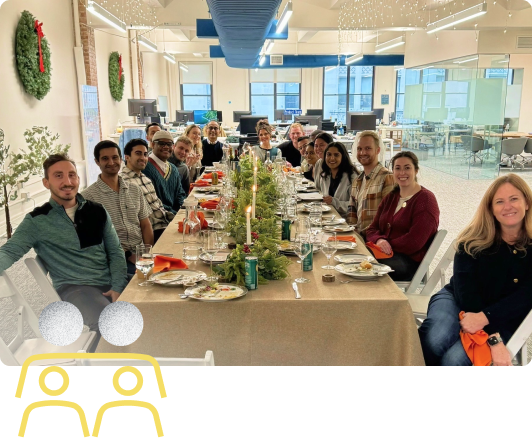 happy people sitting around a holiday dining table