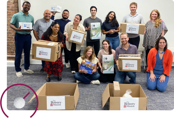 employees packing boxes for charity