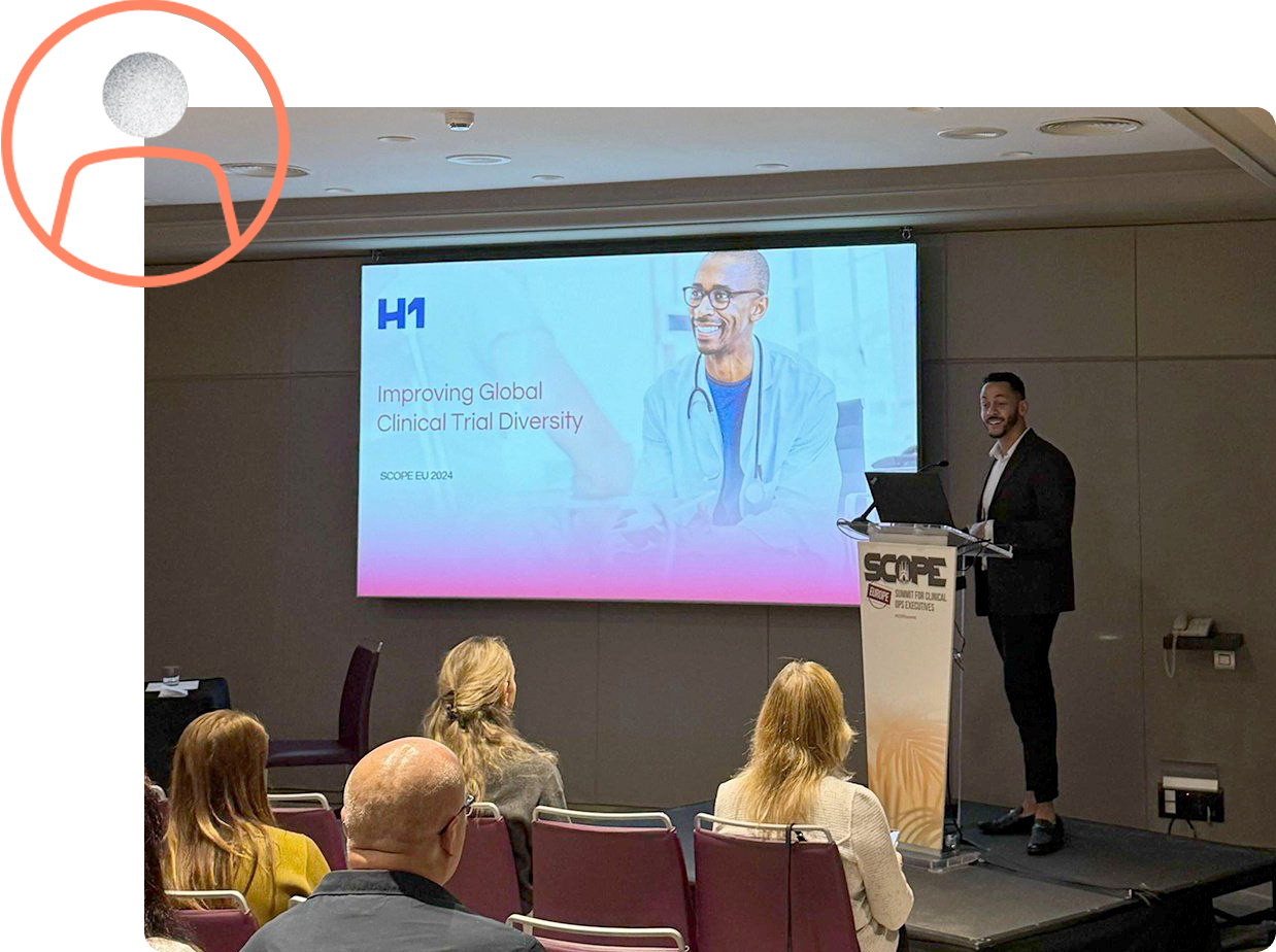 speaker presenting slides to a conference audience