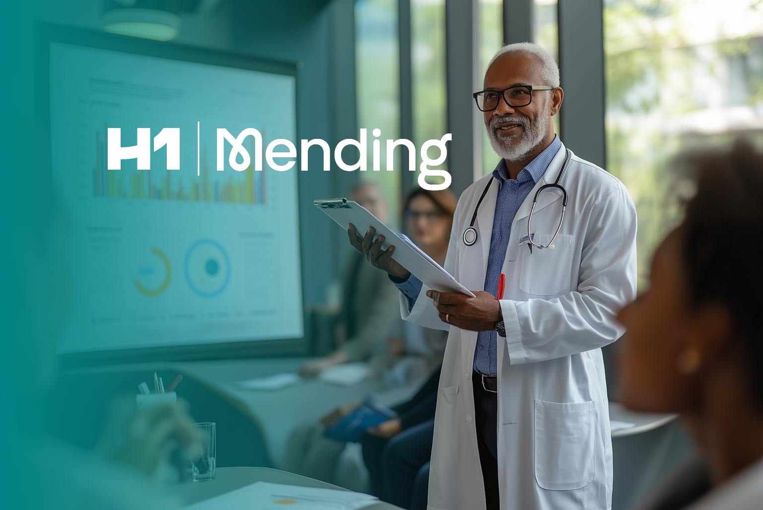 H1 and Mending logos in front of physician