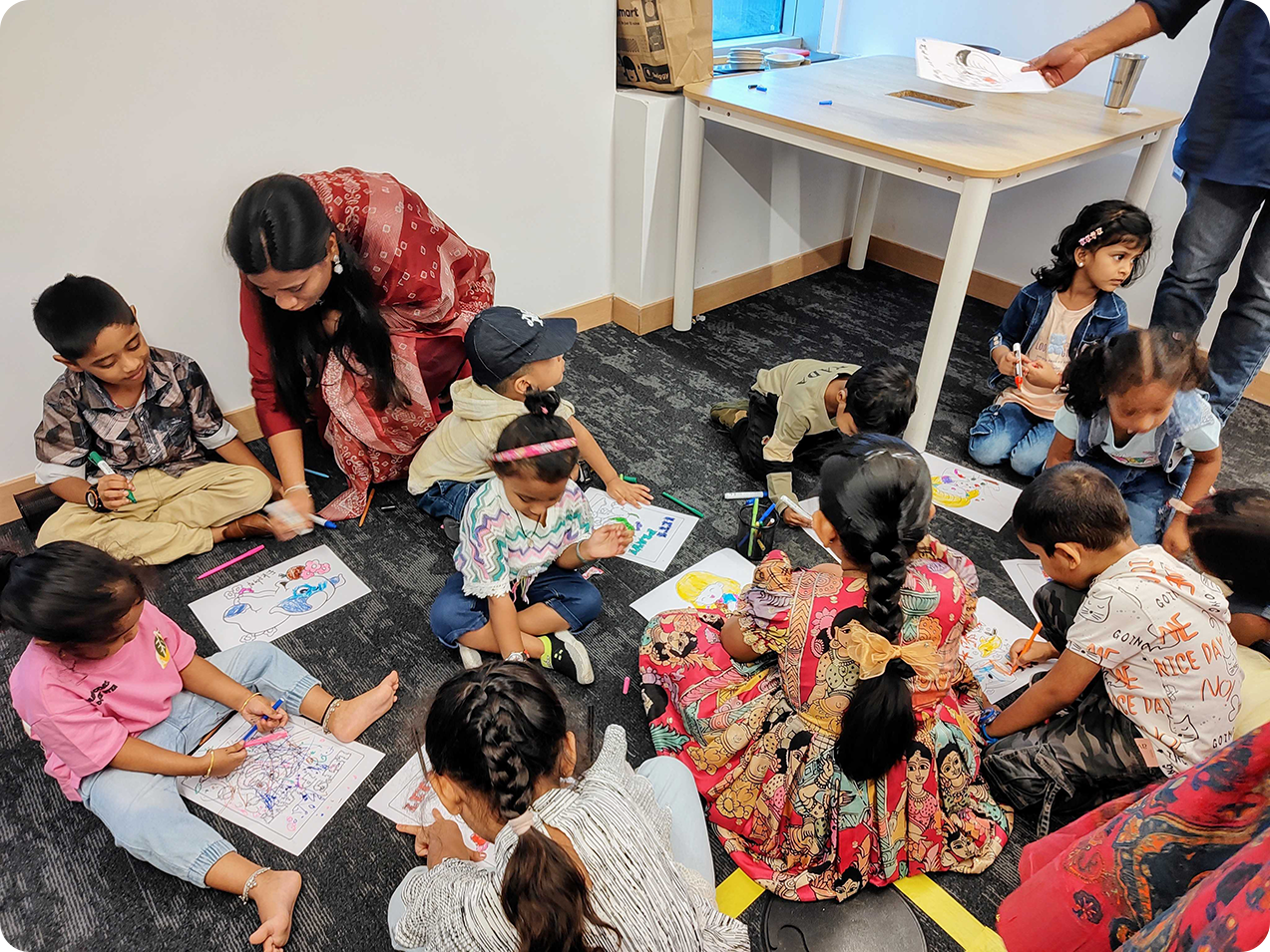 Volunteers doing a craft with children